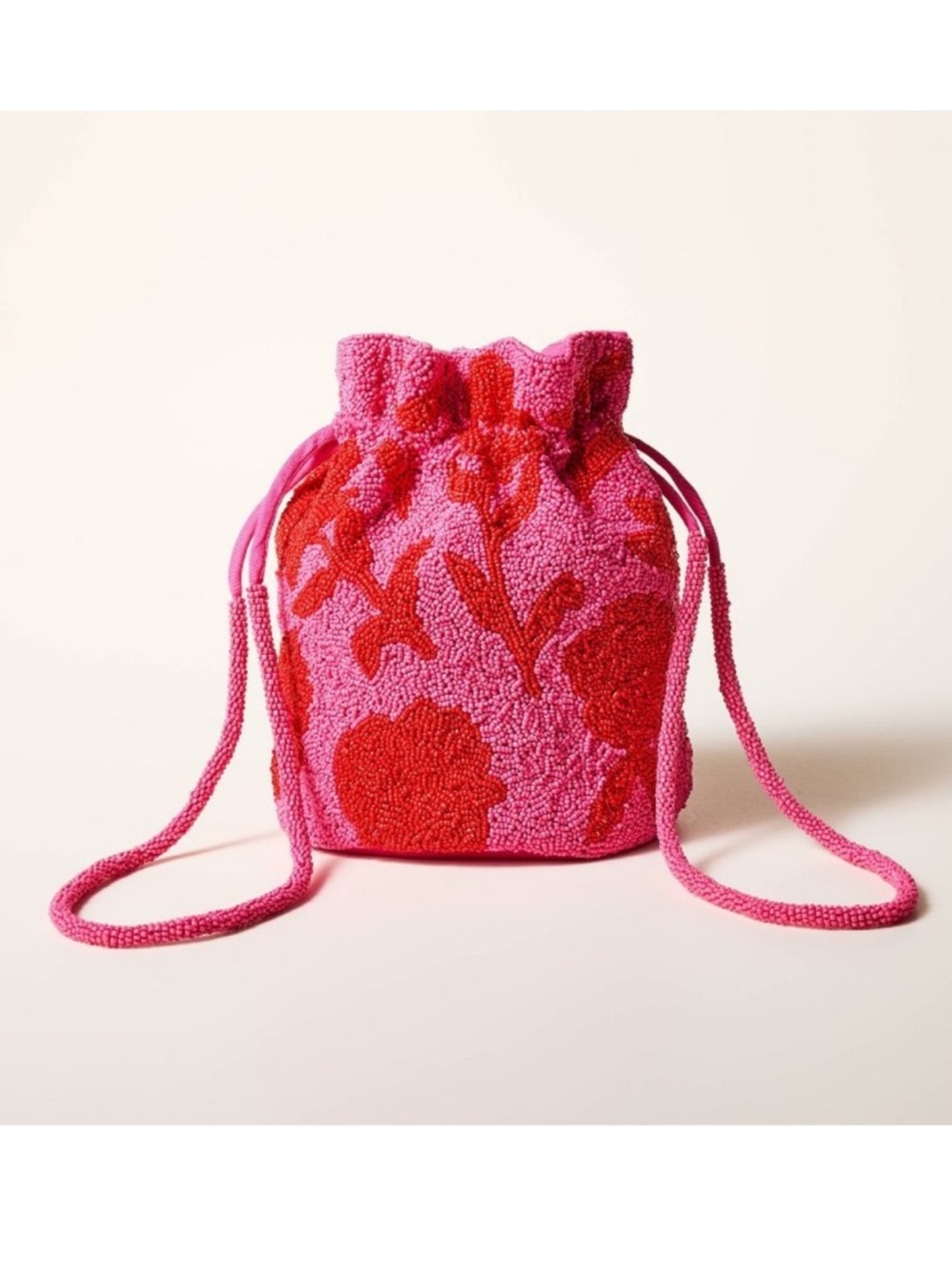 Kate Spade Textured Floral Drawstring Crossbody Bag in Pink & Red